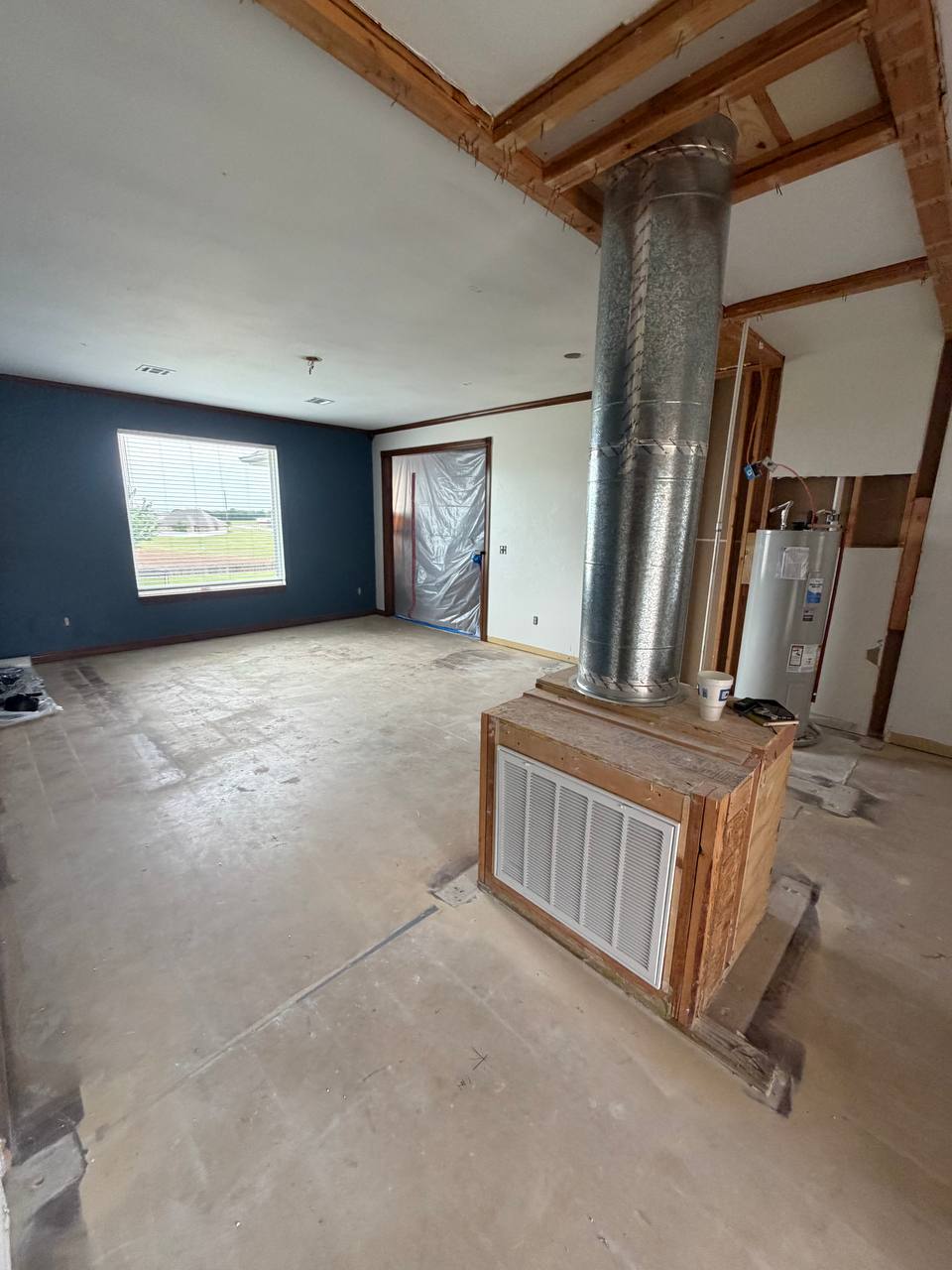 Before — ductwork exposed & original navy accent wall