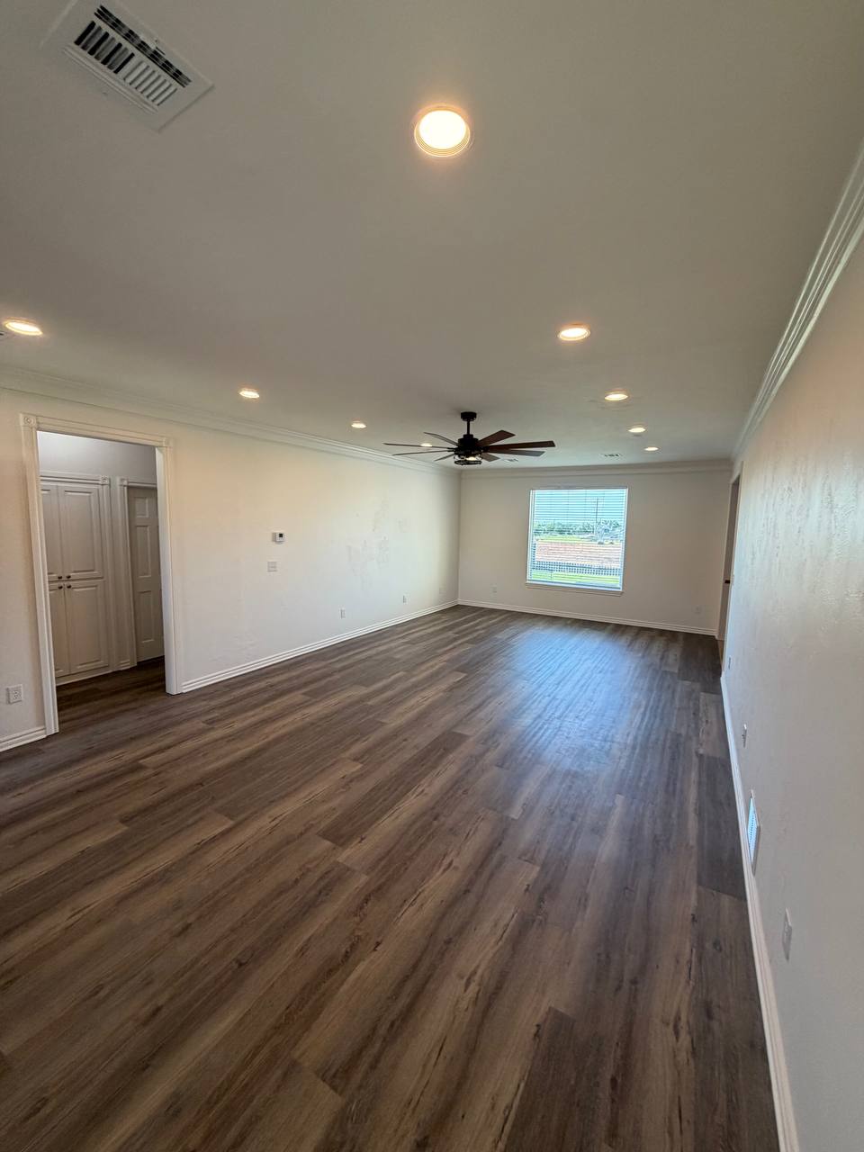After — bedroom with new flooring & fixtures
