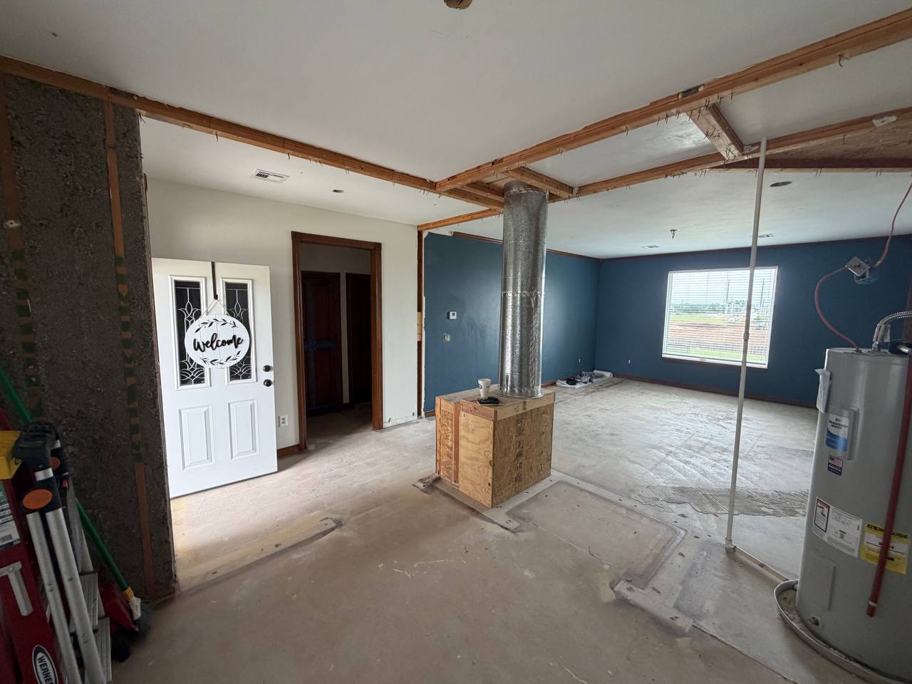 Mid-project — framing rebuilt, ready for drywall