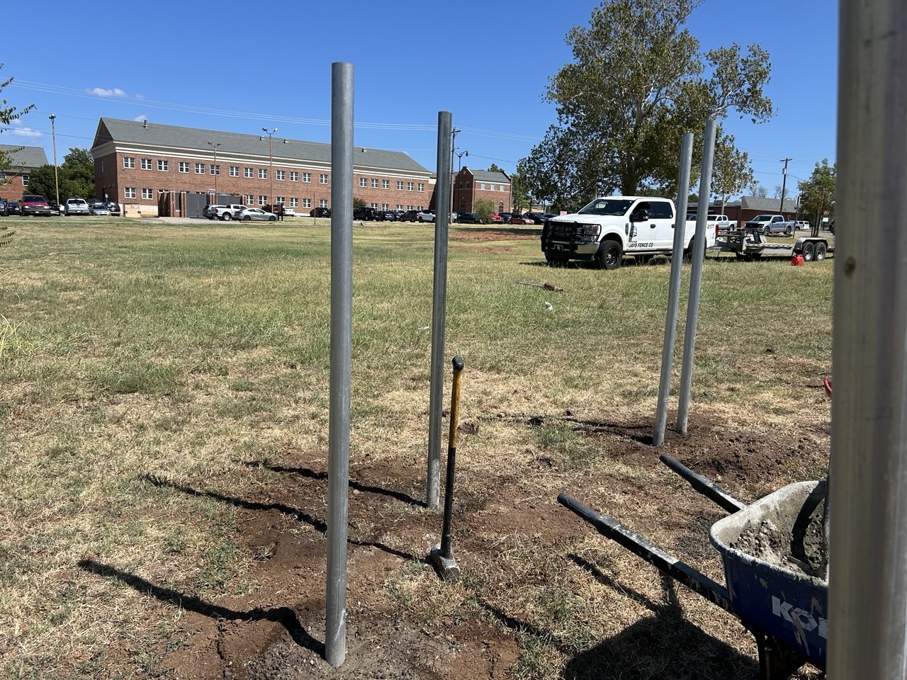 Galvanized steel posts set in concrete