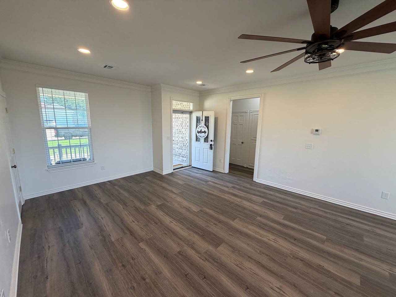 After — front entry with refinished trim & ceiling fan