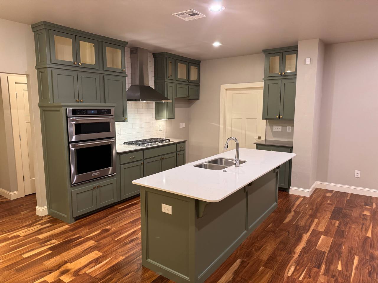 After — sage cabinetry & quartz island