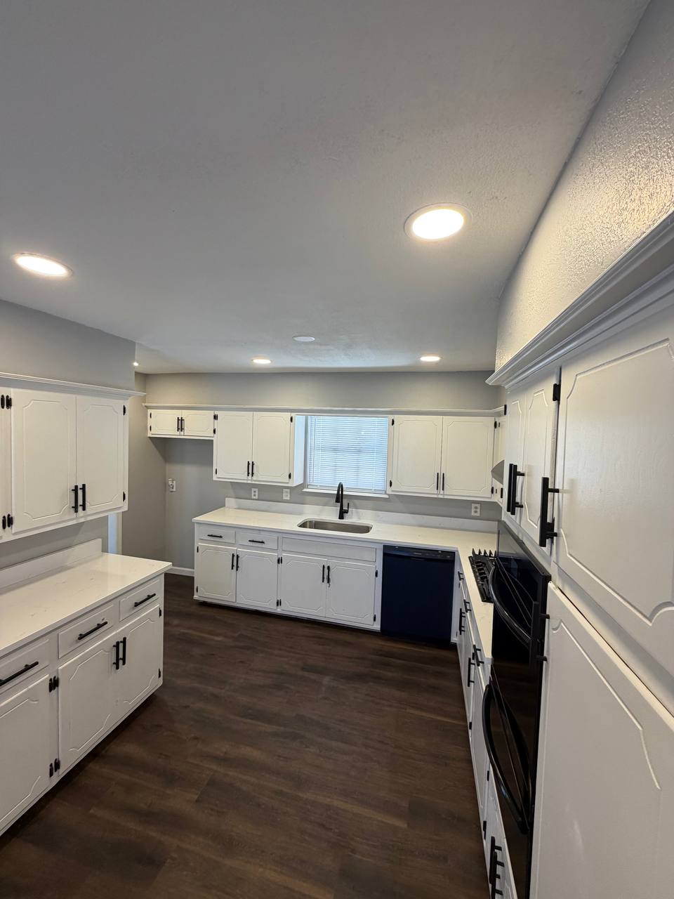 After — dark luxury vinyl plank flooring throughout
