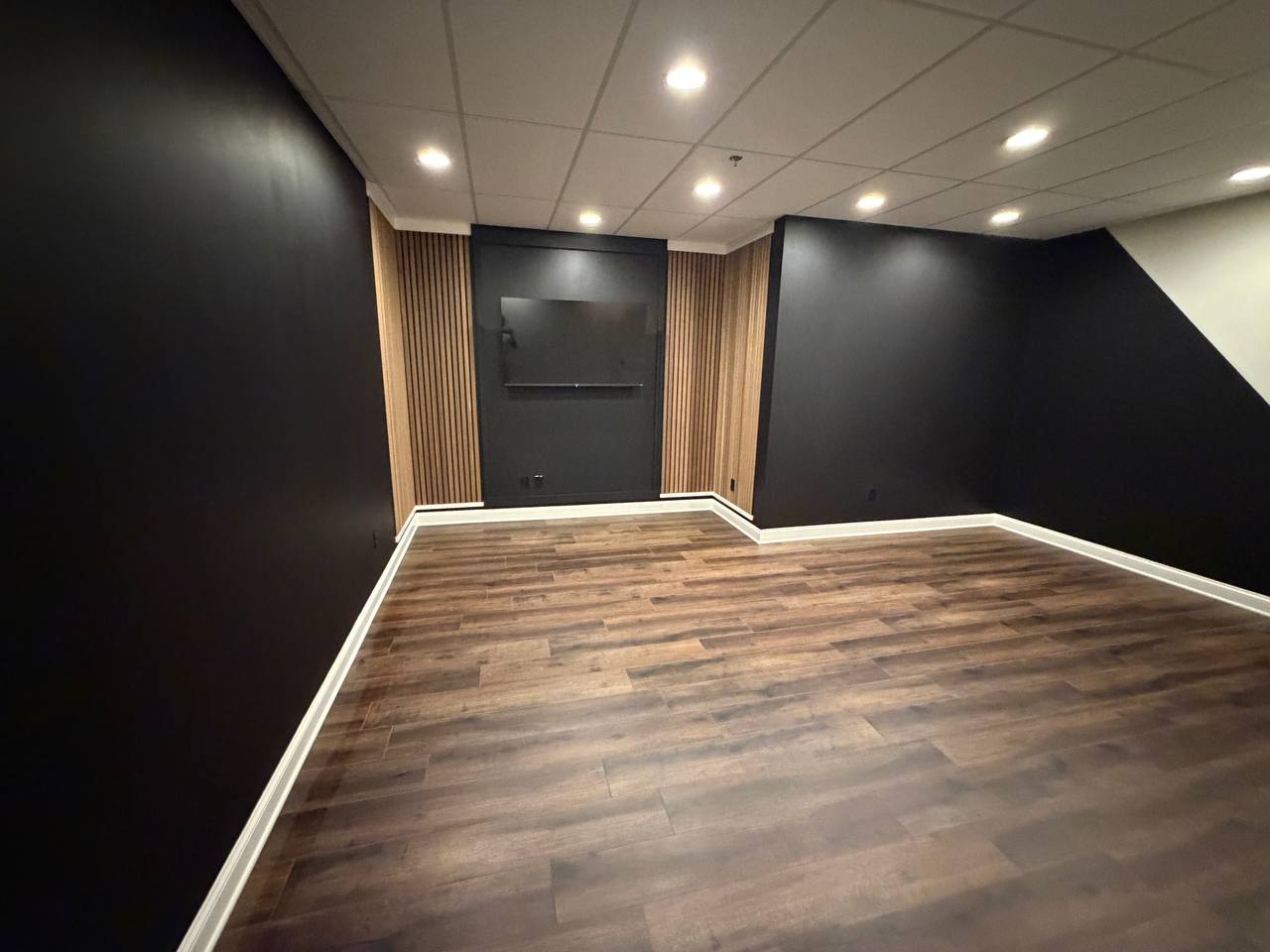 After — slat-framed TV wall ready for production