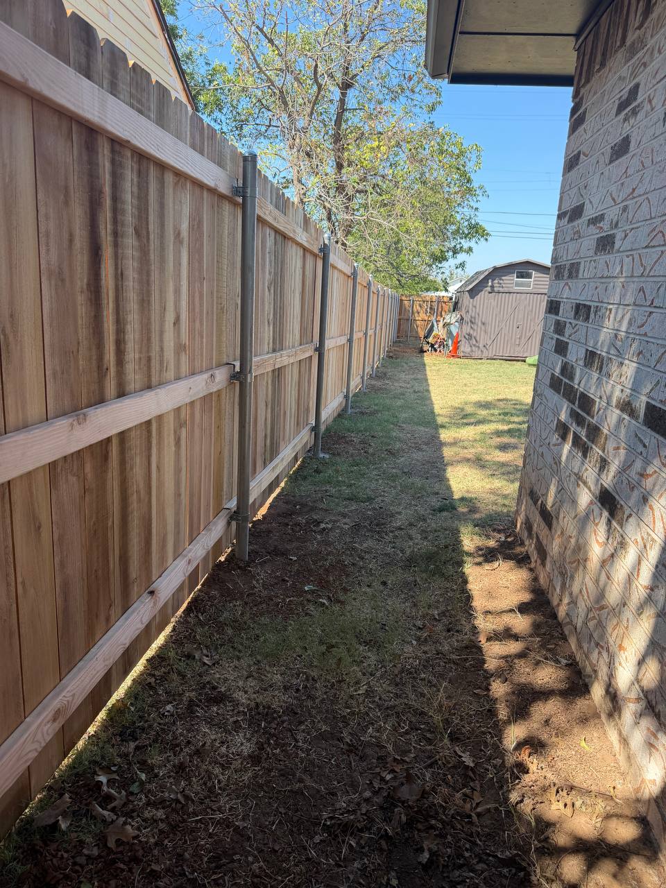 Rails run and pickets going up along the house