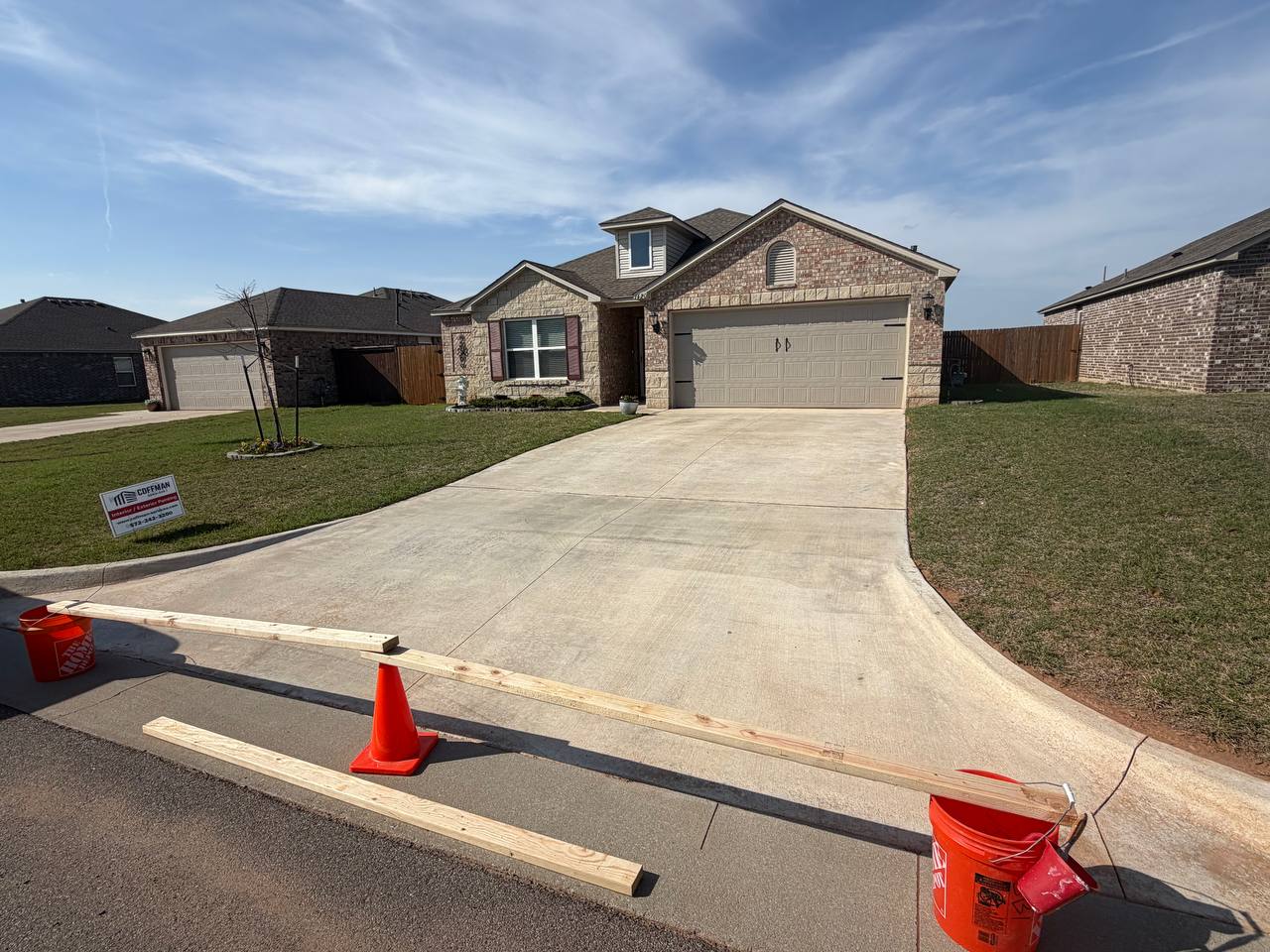 Before — driveway prepped and coned off