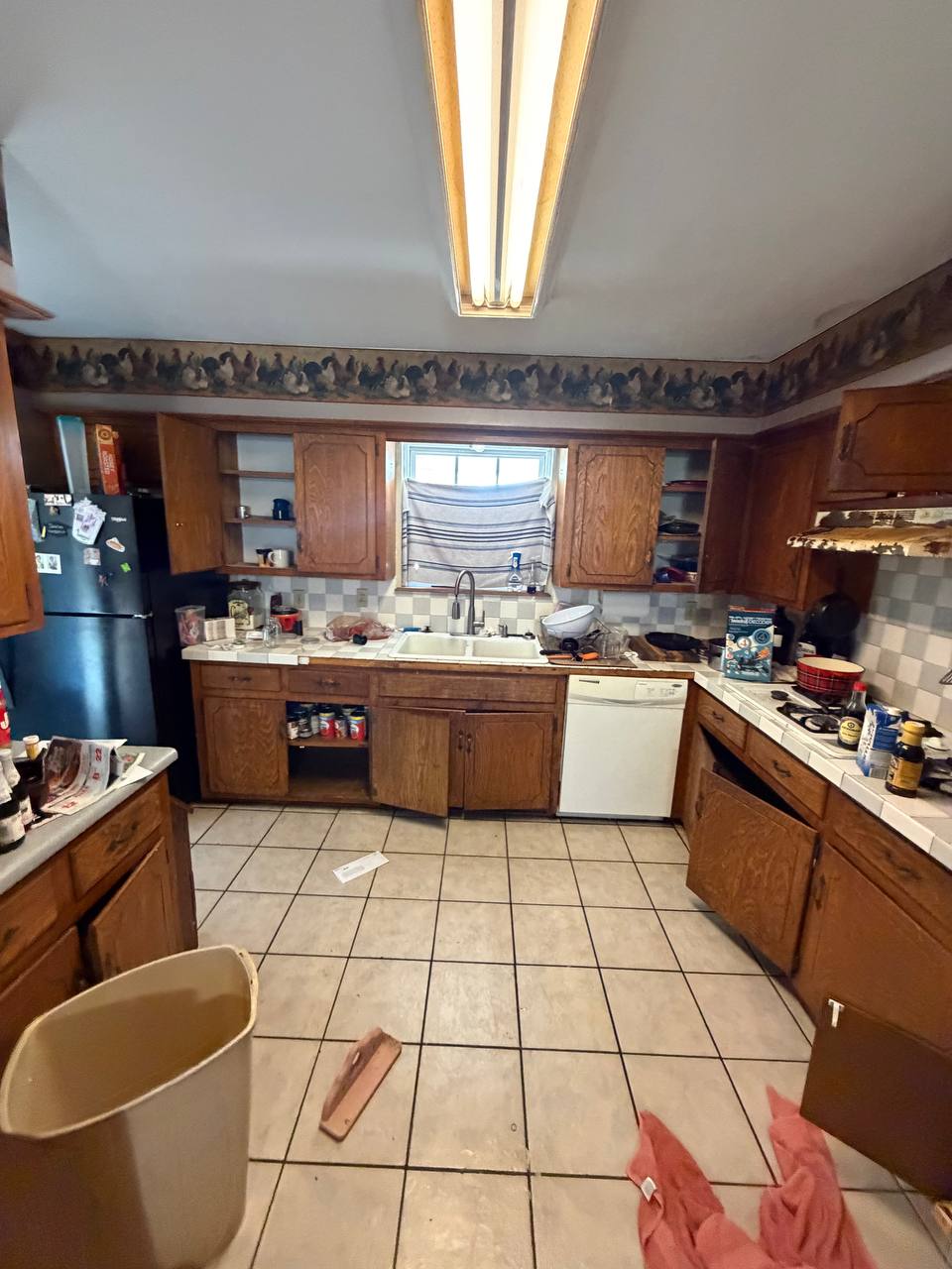 Before — original layout with dated tile flooring and wallpaper border