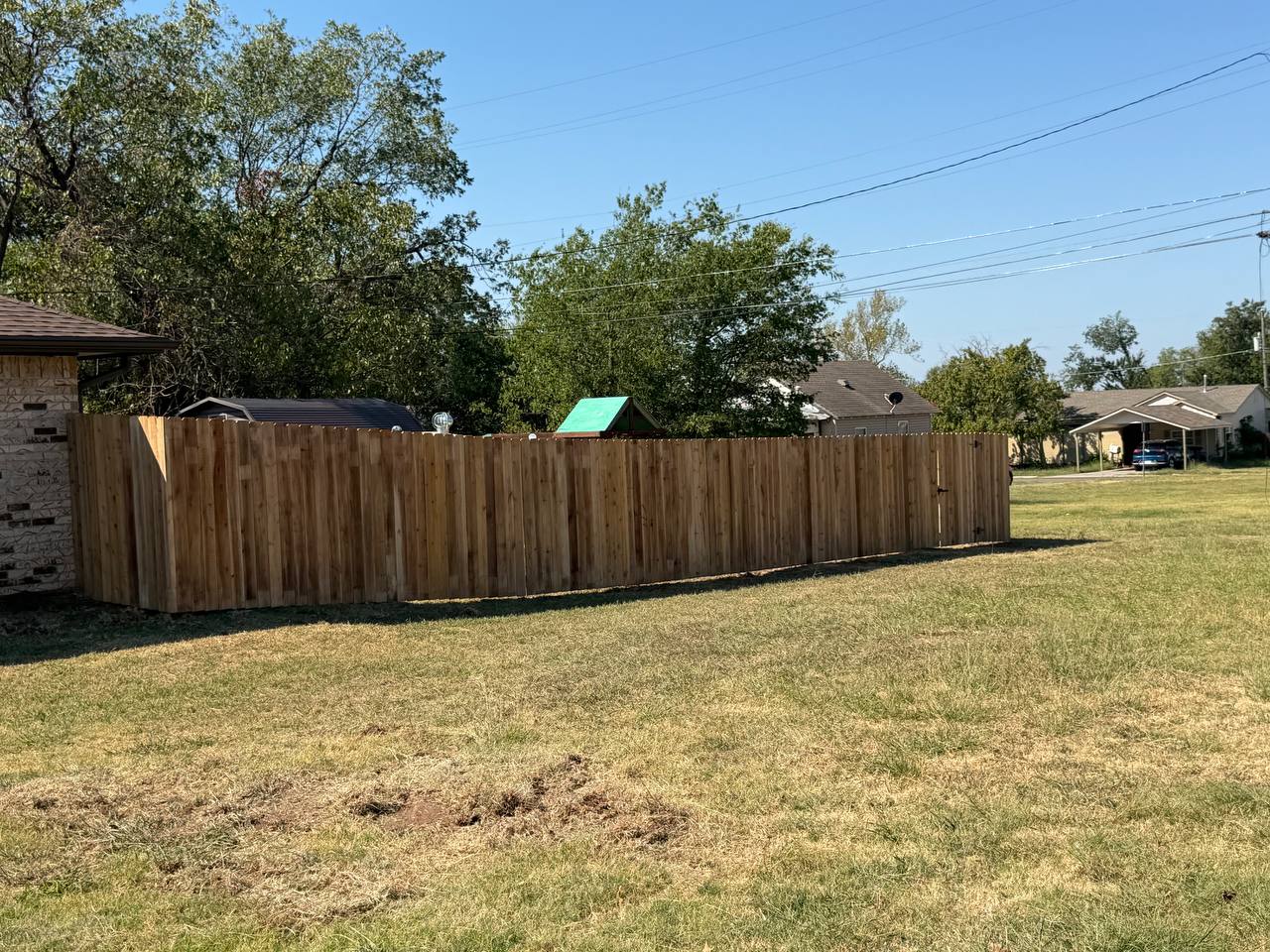 After — full cedar privacy fence around the back yard