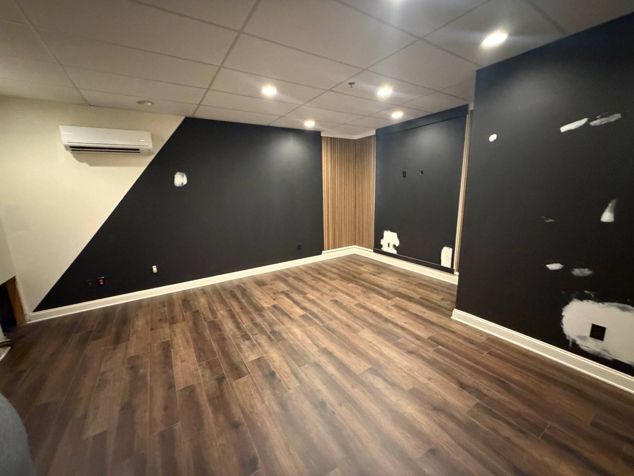 Wood-look plank flooring and new baseboards installed
