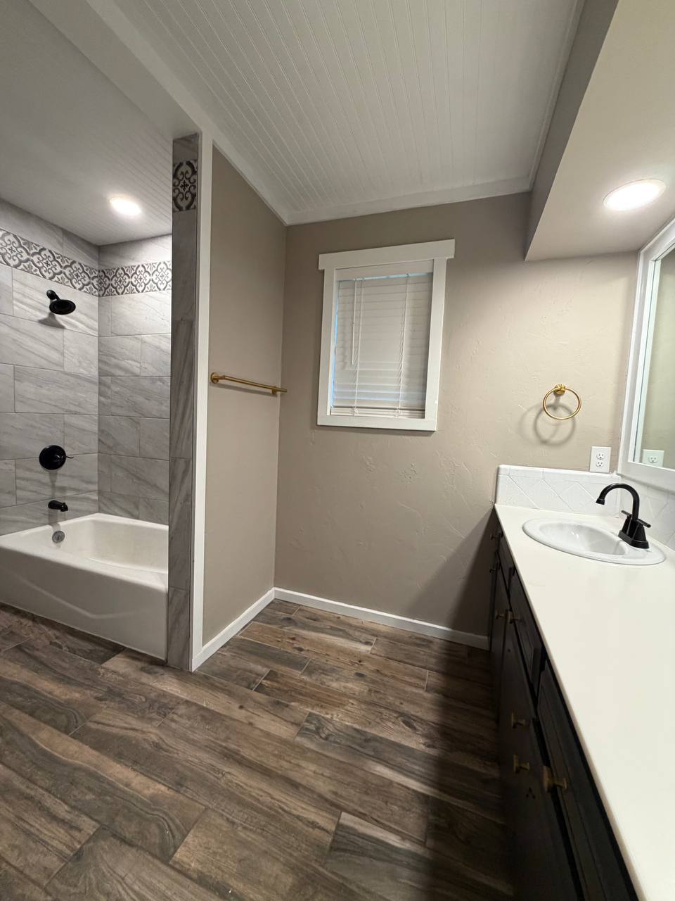Beadboard ceiling, recessed lighting, and wood-look tile flooring