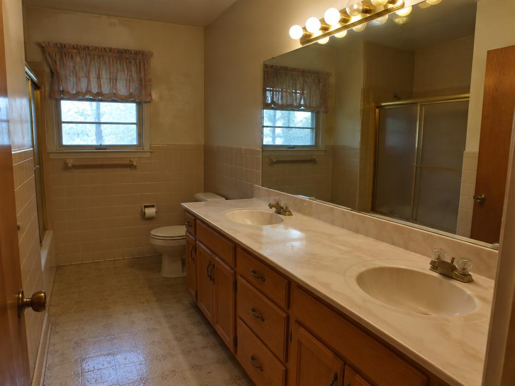 Illustration of a typical dated bathroom, not this home